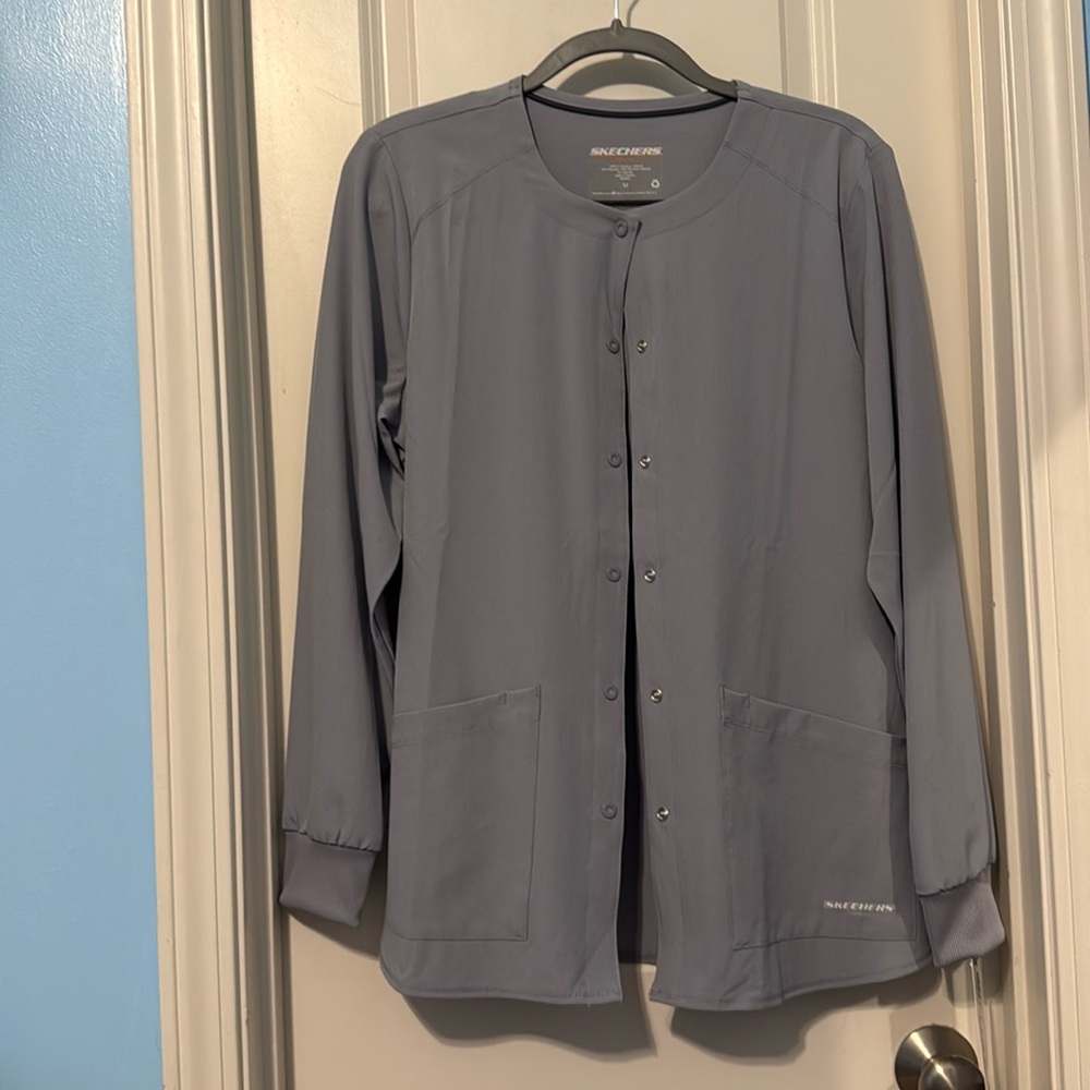 Grey Sketchers by Barco scrub jacket with buttons and front pockets